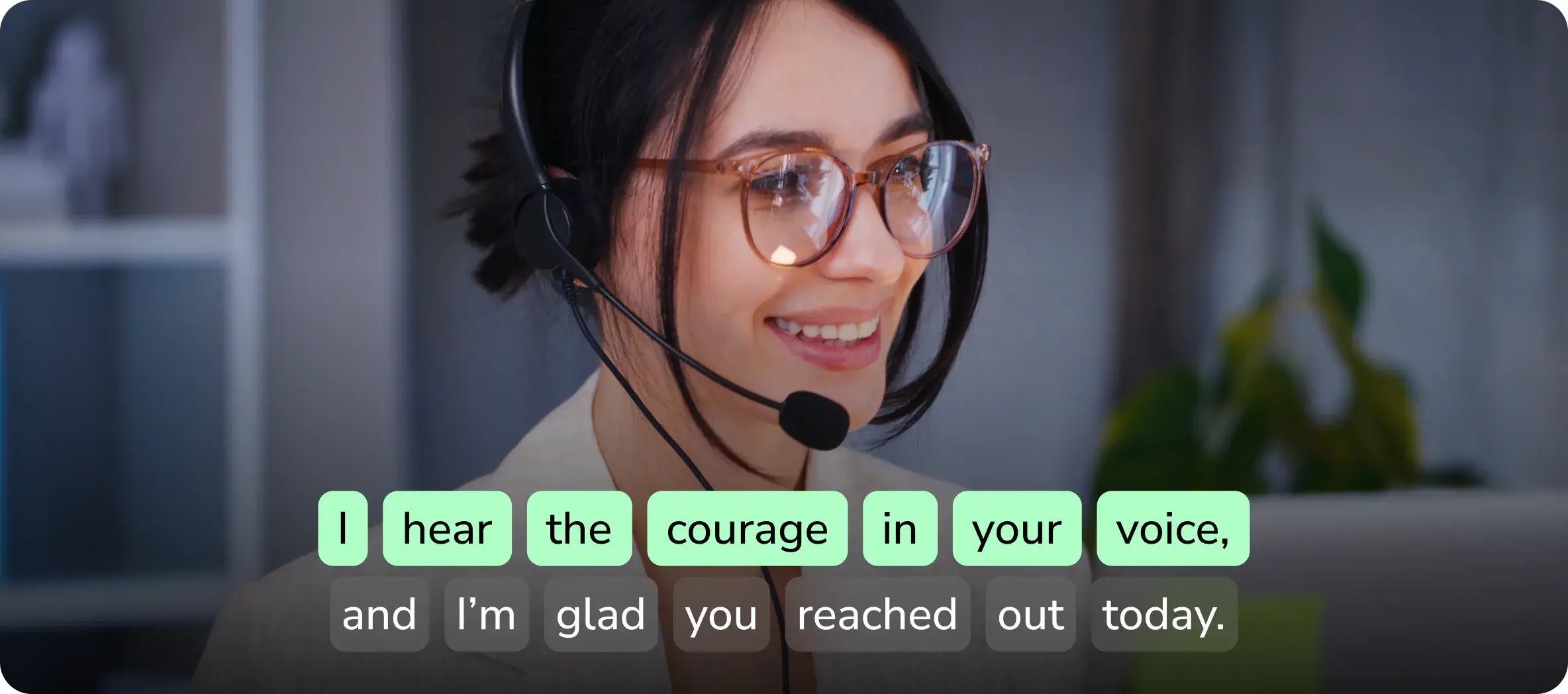 An admissions rep on a headset with real-time teleprompter phrases highlighted